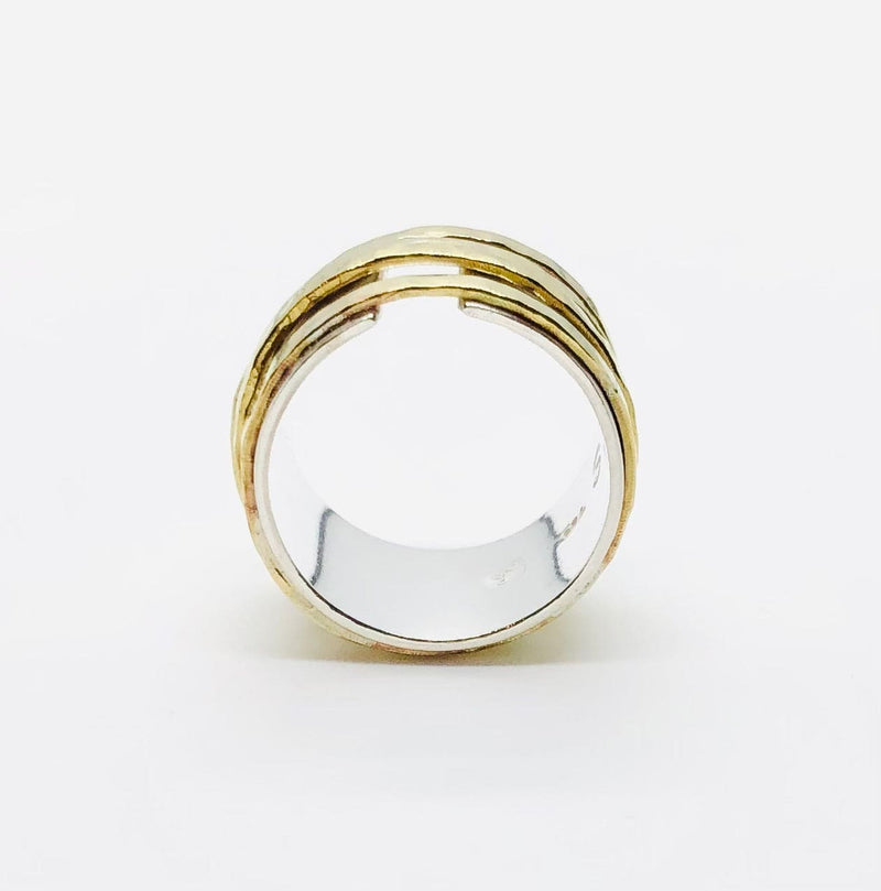 Bague anneau en argent entourée de 4 cerceaux mobiles en laiton. Bijoux Isabelle Salvador